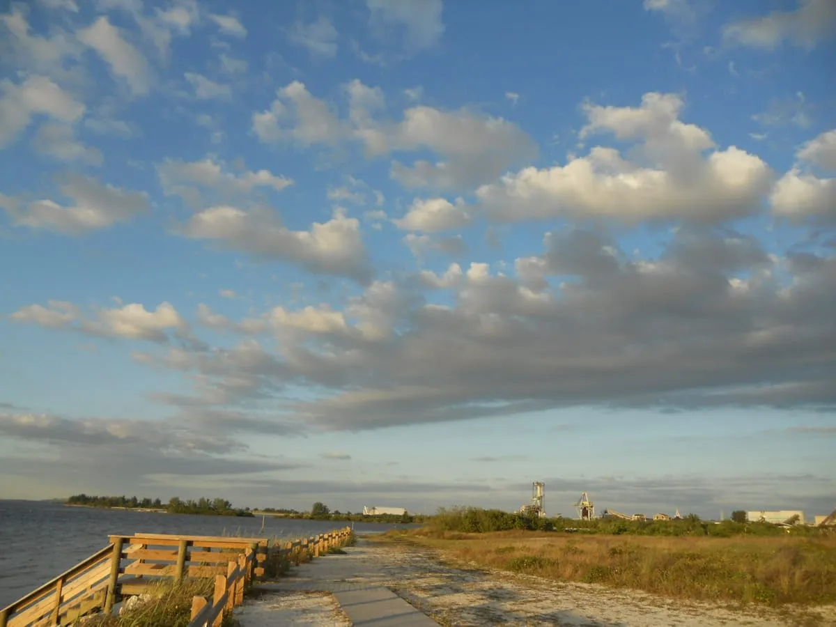 Boardwalk and sandy path along the Tampa Bay shore at Apollo Beach