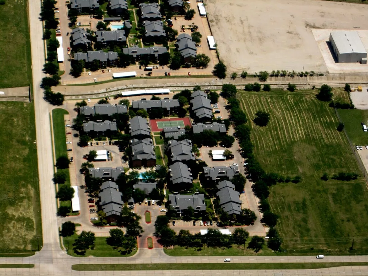 Aerial view of attached housing where each roof spans several units
