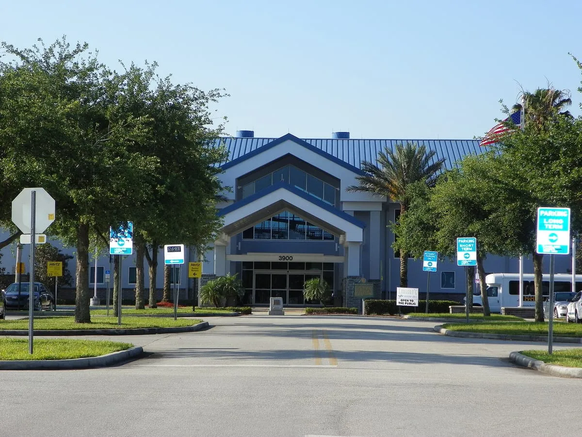 Main terminal building with a blue metal roof at Lakeland Linder airport